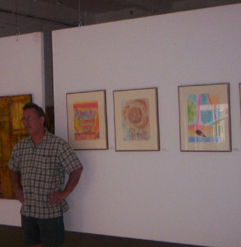 Craig posing with his art ()